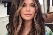 long dark brunette hair with caramel face-framing highlights to accent the face a little bit
