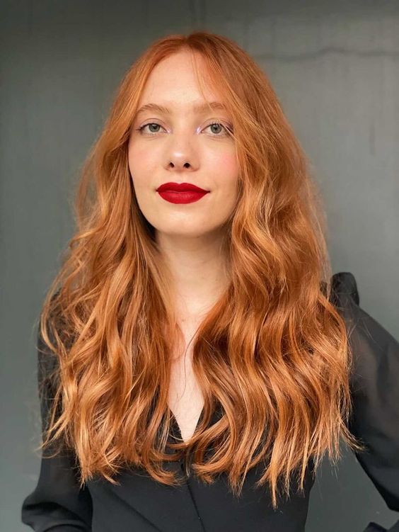 long ginger hair with a lot of volume and waves is a gorgeous solution, it looks fantastic, especially with a red lipstick