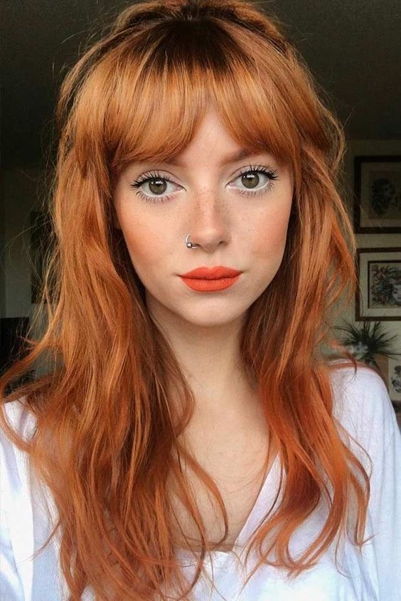 long ginger wavy hair with a curtain fringe and touches of darker shades is a fantastic idea