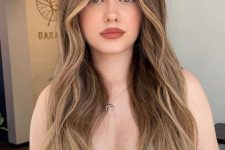 long light brunette hair with blonde balayage and face-framing highlights, volume and waves is amazing