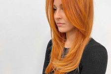 lovely long ginger hair, almost orange, with a bit of layers, is a stylish and bright solution