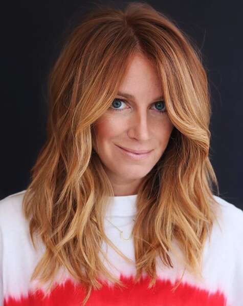 medium-length copper hair with ginger highlights and waves, with a bit of volume, is a catchy and cool idea