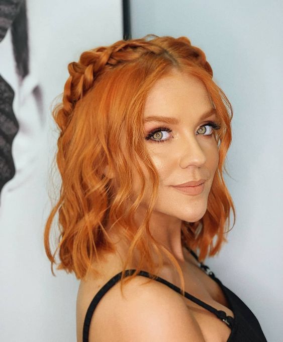 Medium length ginger hair with a braided halo and some waves down is a lovely and catchy idea