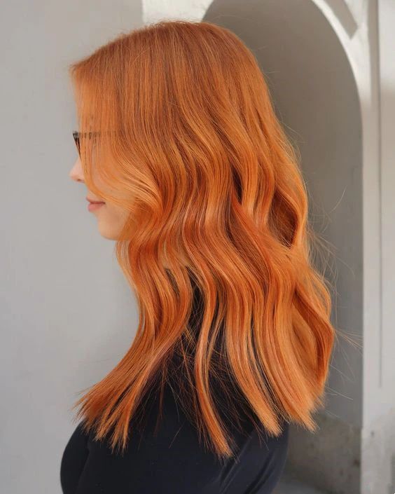 super bold long ginger hair with a bit of waves will be a fantastic idea, it will add a statement to your looks