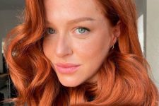 super bright medium-length copper hair with waves and volume is a gorgeous and super chic and bold idea for the fall