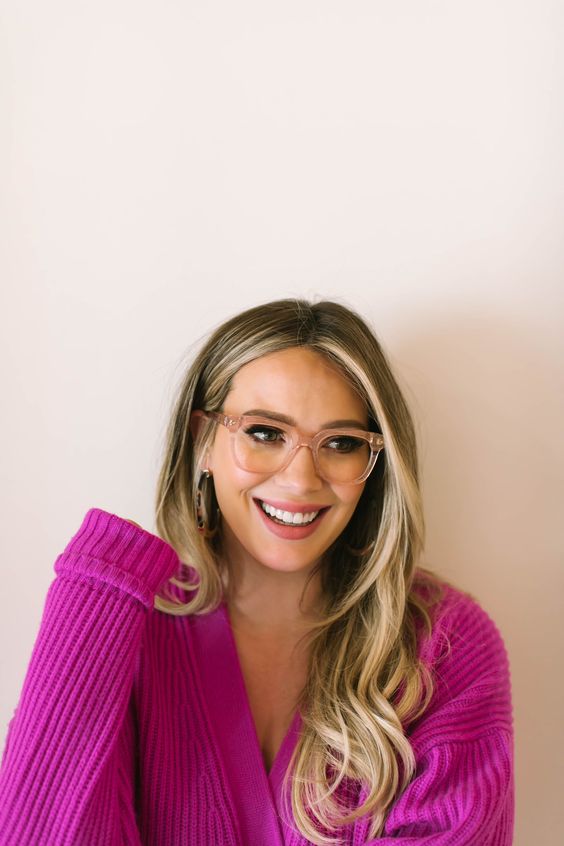 Hilary Duff wearing nude square glasses looks very bold and trendy
