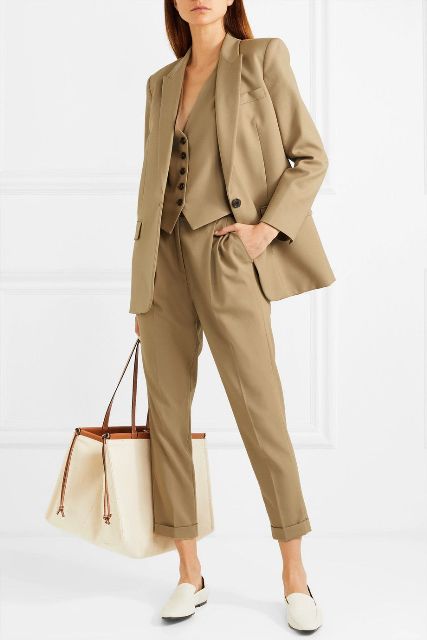 With beige vest, beige loose blazer, cuffed trousers and white flat shoes