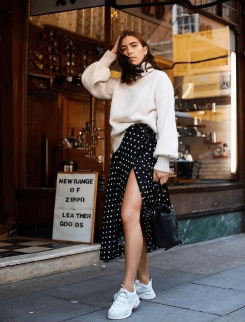 With white loose turtleneck sweater and white sneakers