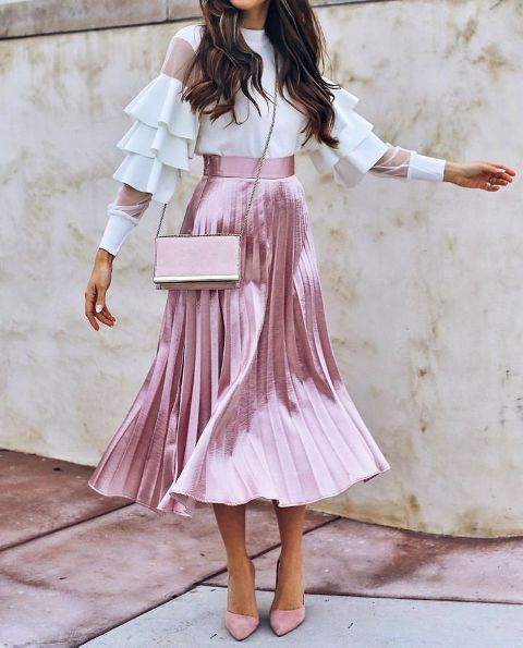 With white ruffled sleeve blouse, metallic pleated midi skirt and pale pink pumps