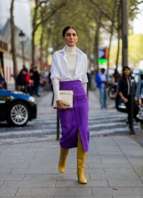 With white turtleneck, white shirt, purple midi skirt and yellow high boots