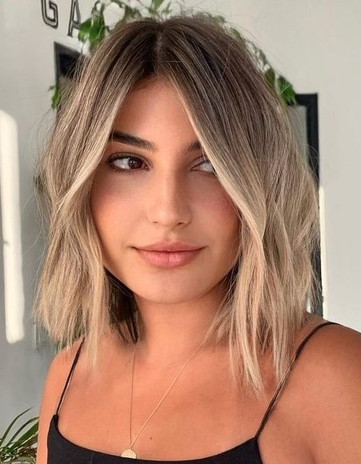 a long bob with darker root and blonde balayage plus messy waves is a beautiful idea to rock any time
