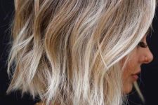 a lovely rooty blonde midi bob done with layers and volumetric texture is a cool and catchy idea to rock