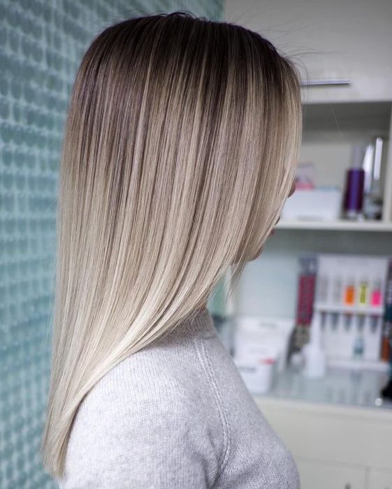 a soft and stylish ombre from darker root to silver champagne and icy blonde is a lovely and chic idea