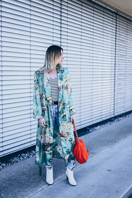 a striped top, blue jeans, white booties, a green maxi floral kimono and a red bag for spring