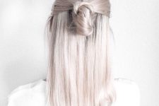 beautiful medium-length silver blonde hair styled in a half updo looks very chic, nice and cool