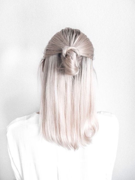 beautiful medium-length silver blonde hair styled in a half updo looks very chic, nice and cool