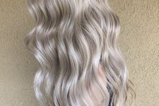 gorgeous long silver blonde hair with waves and a lot of volume is adorable, it looks fresh, cool and bright