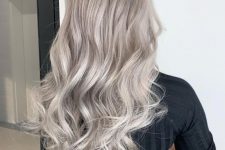long silver blonde hair with waves and a lot of volume is a chic and stylish idea, it looks very eye-catching and lovely