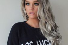 long volumetric hair with dark roots, silver blonde balayage and curls looks amazing and bold