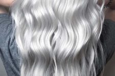 long volumetric silver blonde hair with a bit of waves is a catchy and chic idea that looks very girlish and delicate