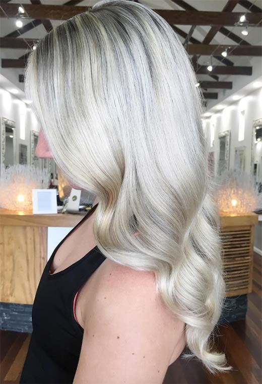 long wavy ciy blonde and silver champagne hair is a lovely idea with a trendy hair color