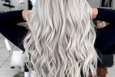 long wavy hair with a lot of volume done in silver blonde is an amazing idea, it looks adorable and eye-catchy