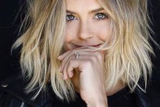 medium-length blonde hair with a darker root and messy touches is a cool and catchy idea