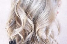 medium-length blonde hair with silver blonde balayage, volume and waves is a very chic and lovely idea