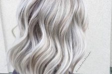 shoulder-length silver blonde hair with waves and volume is a chic and stylish idea, the length is very up-to-date