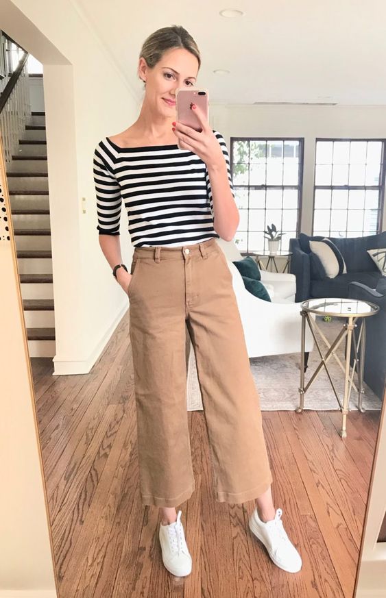 tan wideleg pants, a striped top with short sleeves, white sneakers for a comfortable everyday look