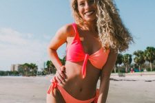 11 a bold color block bikini with a neon orange bottom and a top of neon orange and neon pink is extra bright