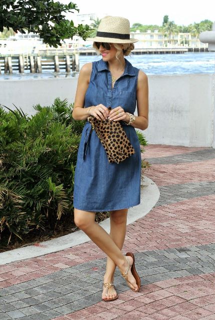 With beige and black hat, leopard printed clutch and golden flat sandals