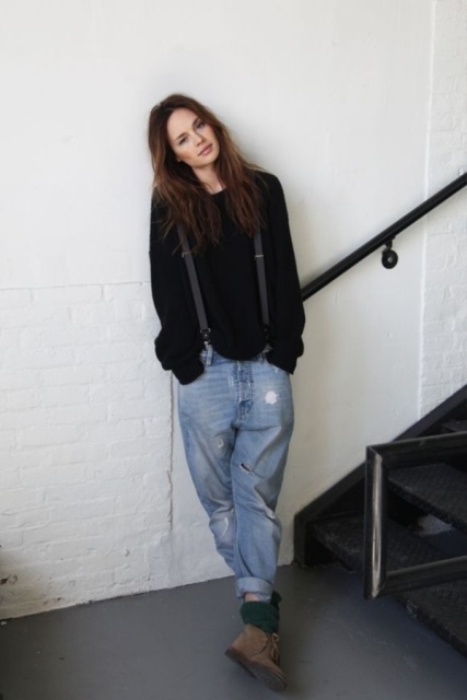 With black loose sweater and suede boots