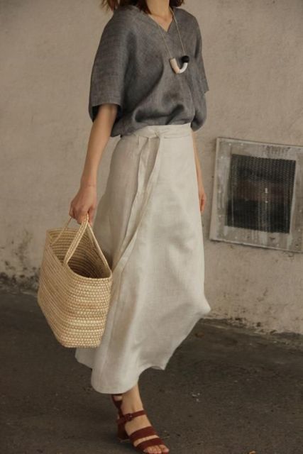 With gray linen loose shirt, straw tote bag and brown leather low heeled sandals