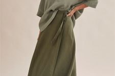With olive green loose shirt and black flat sandals