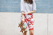 With striped loose shirt, colorful clutch and floral ankle strap high heels