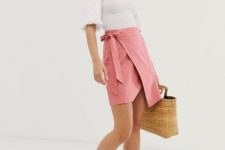 With white off the shoulder blouse, straw bag and beige lace up shoes
