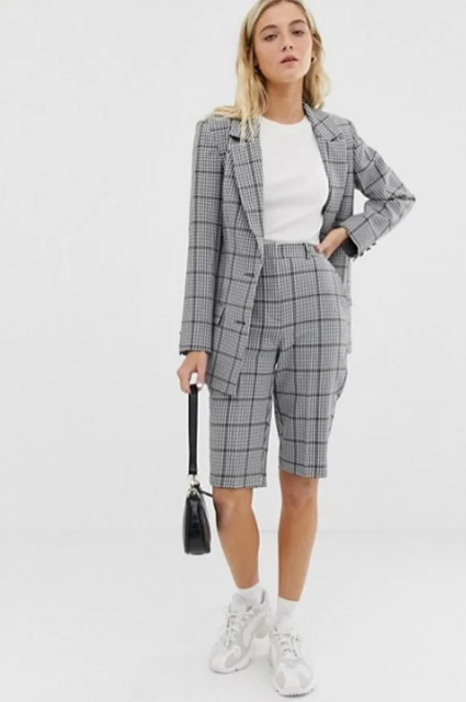 With white t-shirt, black bag, white and light gray sneakers and checked long blazer
