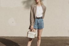 With white t-shirt, printed blazer, bag and black flat shoes