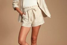 With white top, linen blazer and brown flat sandals