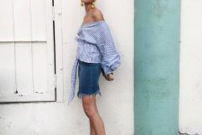 a blue denim skirt, a blue off the shoulder gingham blouse with puff sleeves, gingham shoes and statement earrings