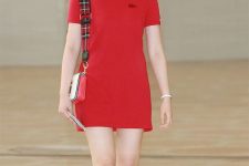 a red polo dress, a mini bag with a plaid strap and white sneakers are a bold summer look