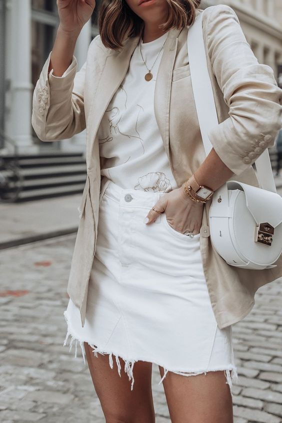 a stylish neutral summer look with a printed tee, a white denim mini, a neutral linen blazer and a white bag