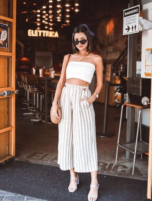 a white bandeau top, striped linen culottes, white block heels and a round woven bag for summer