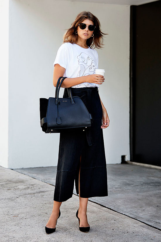 a white printed tee, a black front and back slit midi skirt, a black tote and black shoes