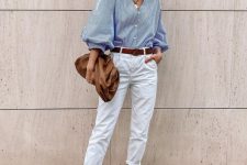 white jeans, a blue shirt with puff sleeves, white shoes, a brown belt and a bag