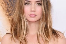 05 Ana de Armas wearing light brunette hair and sunkissed balayage looks gorgeous and messy texture adds a relaxed touch