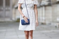 09 an off the shoulder polka dot over the knee dress, blue lace up shoes, a navy bag for a romantic look