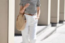 20 a striped t-shirt, white linen pants, brown slippers, a brown belt and a round woven bag