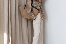 24 an oversized white and tan striped shirt, white linen pants, white sneakers and a neutral tote